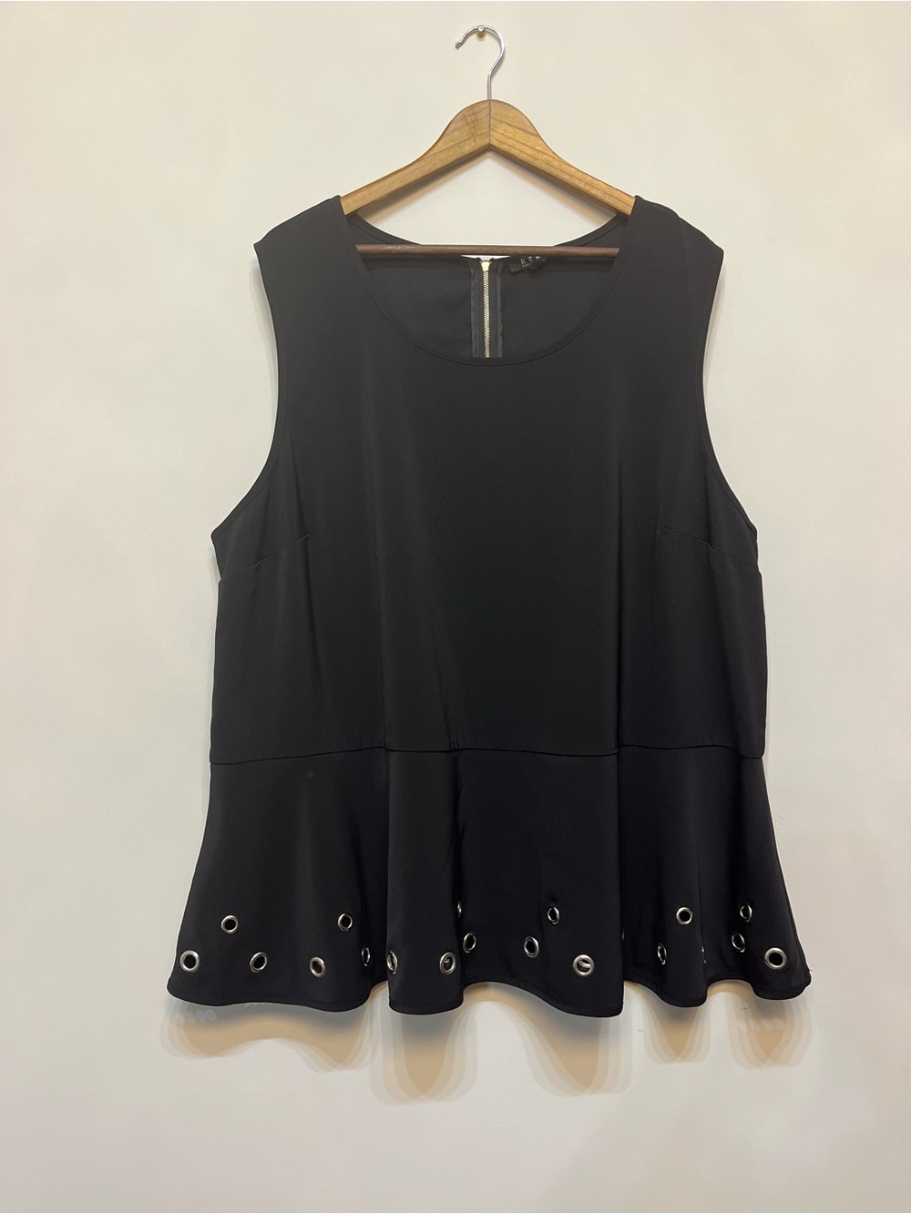 Rebel Black Sleeveless Peplum Tank with Silver Grommet Hem